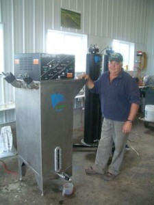 Roger Rainville with BioPro 190 automated biodiesel processor at Borderview Farm. Photo: Vermont Bioenergy Initiative